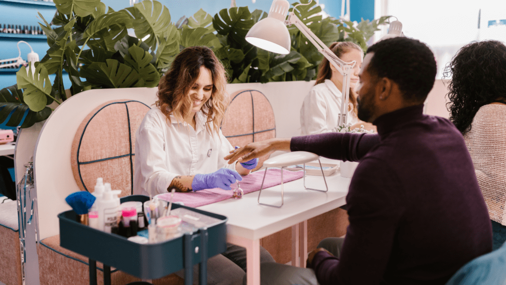 Man having Manicure in Salon 