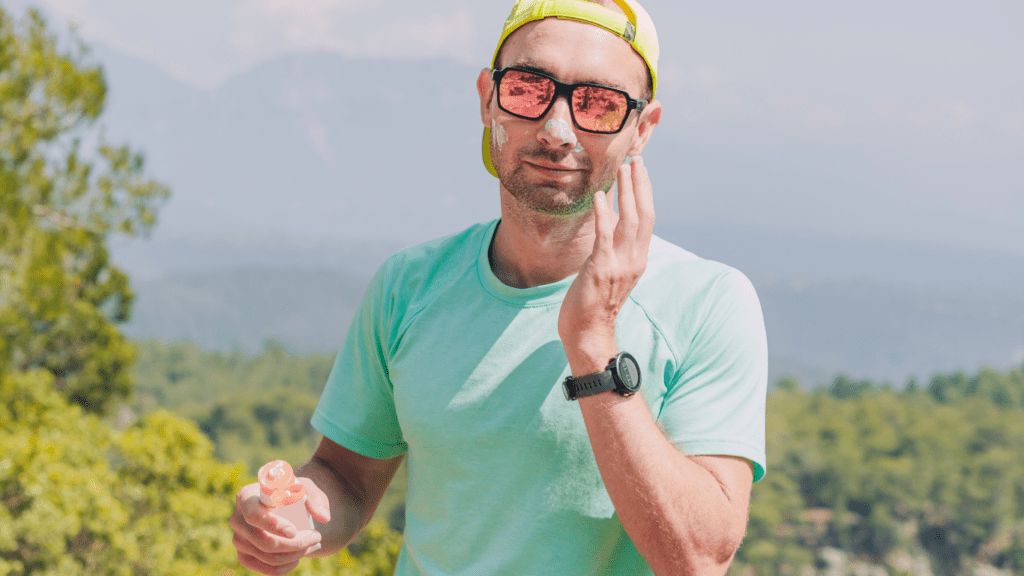 Man applying sunscreen